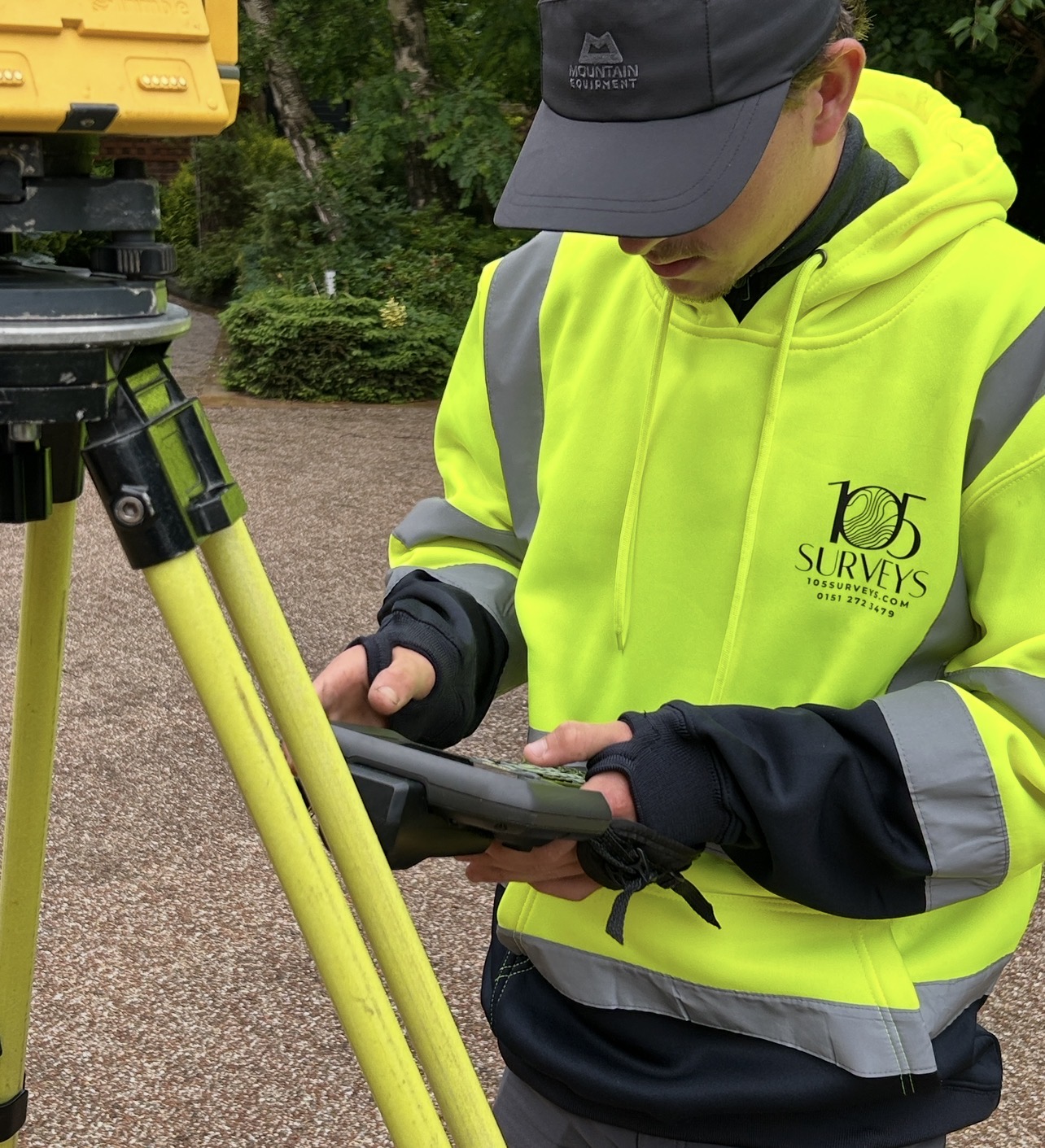 105 Surveys surveyor on site conducting a measured building survey